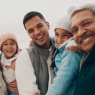 Happy hispanic family in the winter