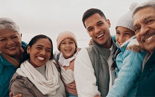 Happy hispanic family in the winter